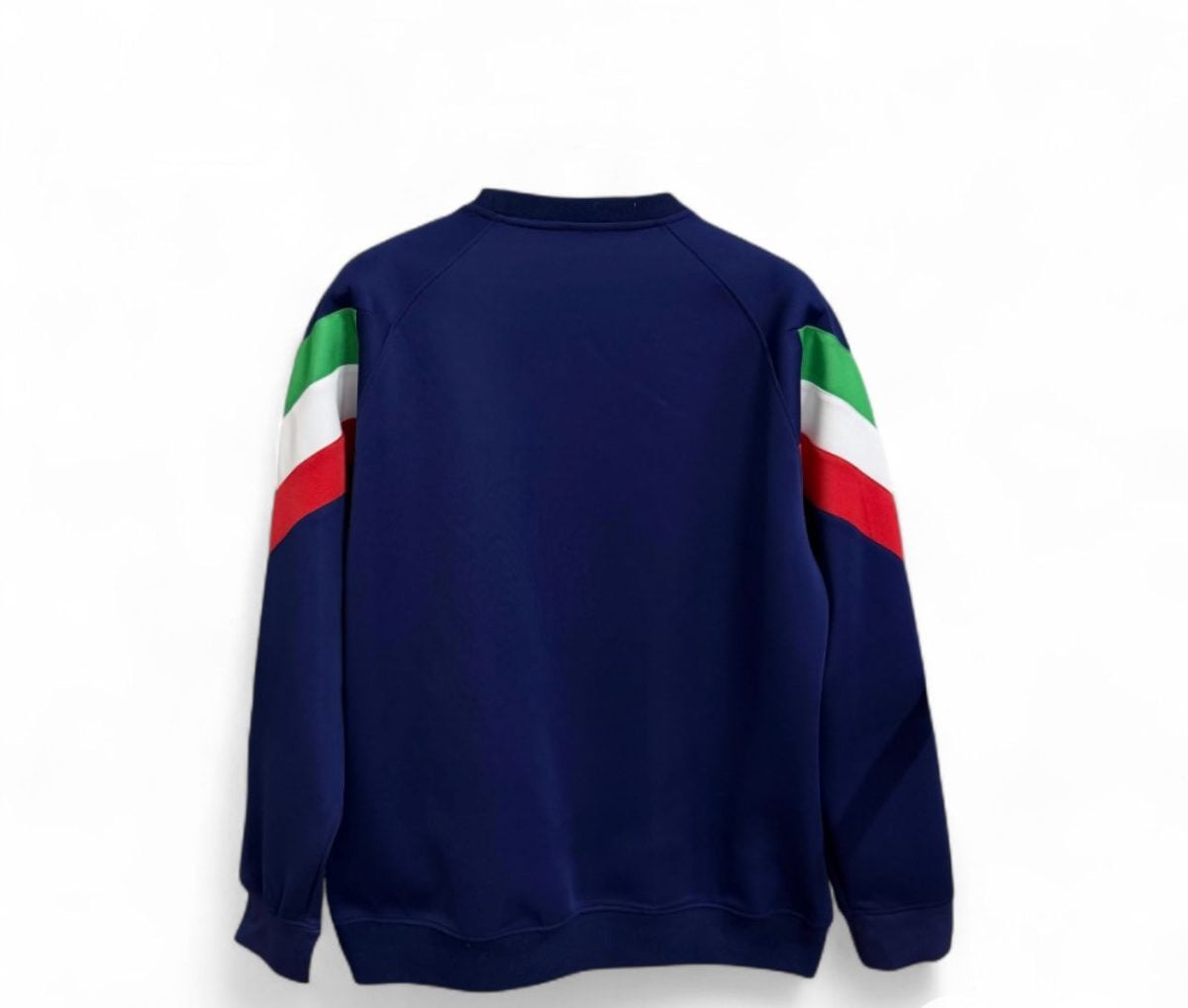 Back view of a navy sweatshirt with green, white, and red color-blocked sleeves.