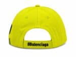 Bright neon-yellow baseball cap shown from the back with an adjustable strap reading ' Balenciaga' at the buckle area.