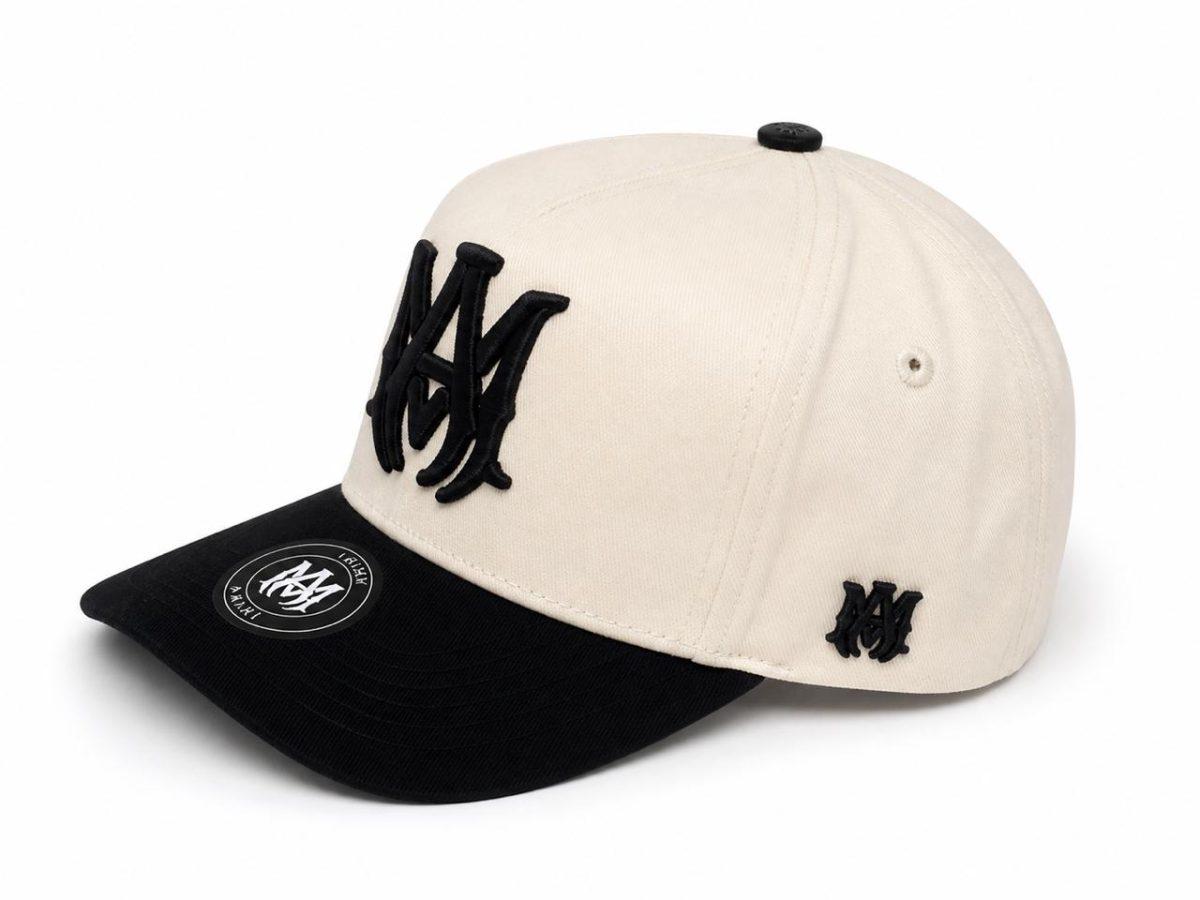 Beige cap with black brim and large black intertwined NY logo on the front; small black emblem on the side.