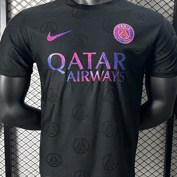 Black Paris Saint-Germain football jersey on a mannequin, featuring the pink Nike swoosh, PSG crest, and a purple-pink Qatar Airways sponsor across the chest.
