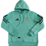 Turquoise Real Madrid hoodie with hood, crest on chest and Adidas logo; black stripes on sleeves and front pocket detail visible.