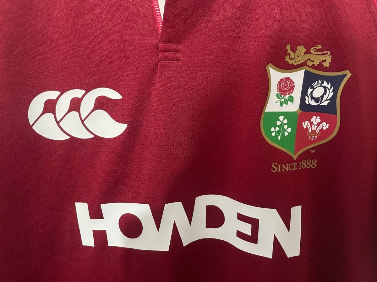 Maroon rugby jersey featuring the Canterbury logo on the left and a team crest with four quadrants and a gold lion above. Mention of 'Since 1888' appears nearby.