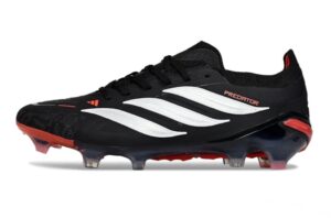 96cfcd1d-855a-4d7b-9f7a-050c26f90b5f | UAE SPORT STORE Black Adidas Predator soccer cleat with white stripes and red accents on a white background, studded sole visible.