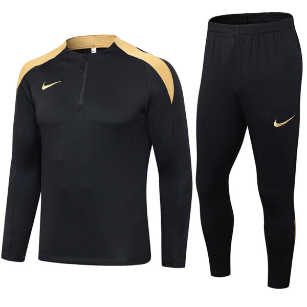 Black Nike athletic long-sleeve top with gold shoulder panels and matching black jogger pants featuring gold swoosh logos — a matching training set.