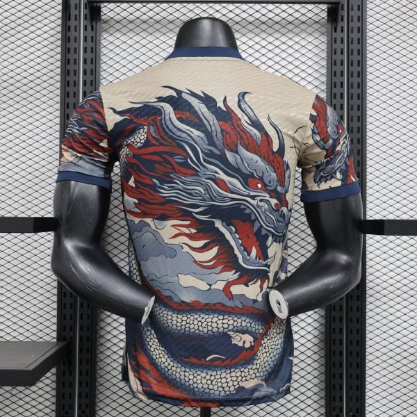 Back view of a mannequin wearing a beige dragon-pattern shirt, standing in front of a metal grid rack.