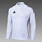White athletic long-sleeve zip-up top with Adidas logo and three stripes on shoulders, lightweight training jersey