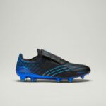 991bb67b-b9fd-46d8-8cb9-f86dd8d7ee08 | UAE SPORT STORE Blue and black soccer cleat with blue studs, side view showing textured upper and blue sole.