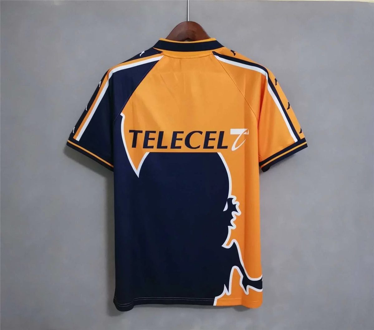 Back view of an orange and navy sports jersey on a hanger featuring the Telecel logo.