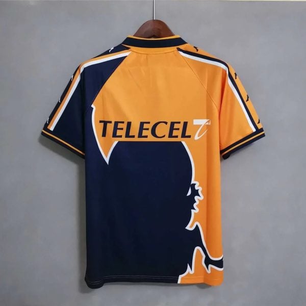 Back view of an orange and navy sports jersey on a hanger featuring the Telecel logo.