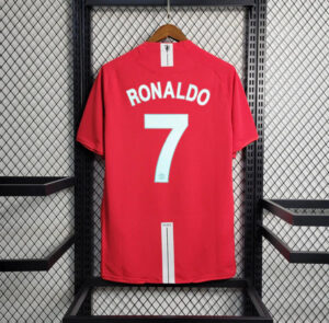 Red Ronaldo #7 Manchester United jersey hanging on a rack in a locker.