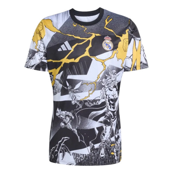 Real Madrid graphic T‑shirt with yellow lightning graphics and comic-style panels across a black, white design, featuring the club crest on the chest.