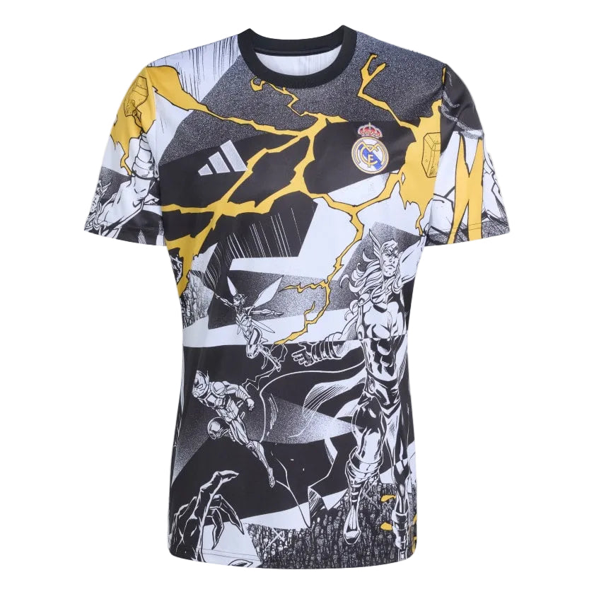 9DEED072-E95B-48C2-9885-4A041B36A27C Real Madrid graphic T‑shirt with yellow lightning graphics and comic-style panels across a black, white design, featuring the club crest on the chest.