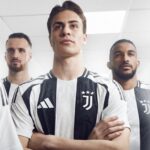 9Ru8bx1lapQYx0V | UAE SPORT STORE Three soccer players wearing Juventus black-and-white striped jerseys stand with crossed arms in a bright room, posing for a team photo.