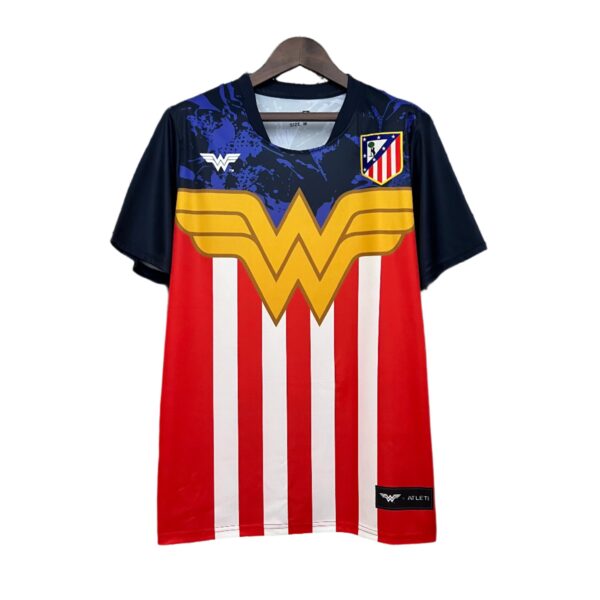 Athletic jersey on a hanger with blue and red pattern, featuring a large gold 'W' emblem and a chest badge that resembles an Atlético shield.