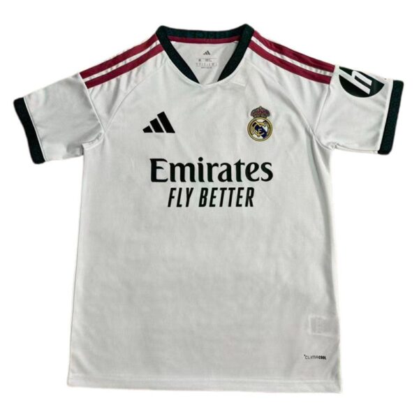 White Real Madrid football jersey featuring the crest, Adidas logo, maroon shoulder stripes, and the sponsor 'Emirates Fly Better'.