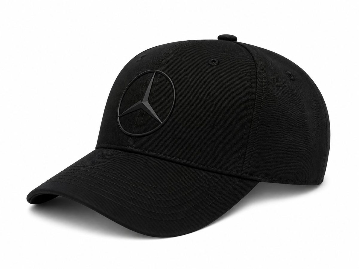 Black baseball cap with a Mercedes-Benz circular star emblem on the front panel, angled to the left.