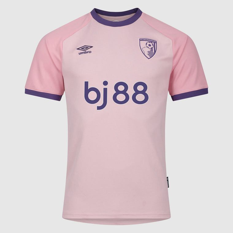 9bcca340-8d68-41ab-9274-36f2d20e6e04 Pink soccer jersey with purple trim, Umbro logo on left chest and team crest on the right, sponsor text 'bj88' across the front.