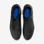 Top-down view of black soccer cleats with blue interior, showing laces and subtle perforations, Nike swoosh on the side left shoe visible.