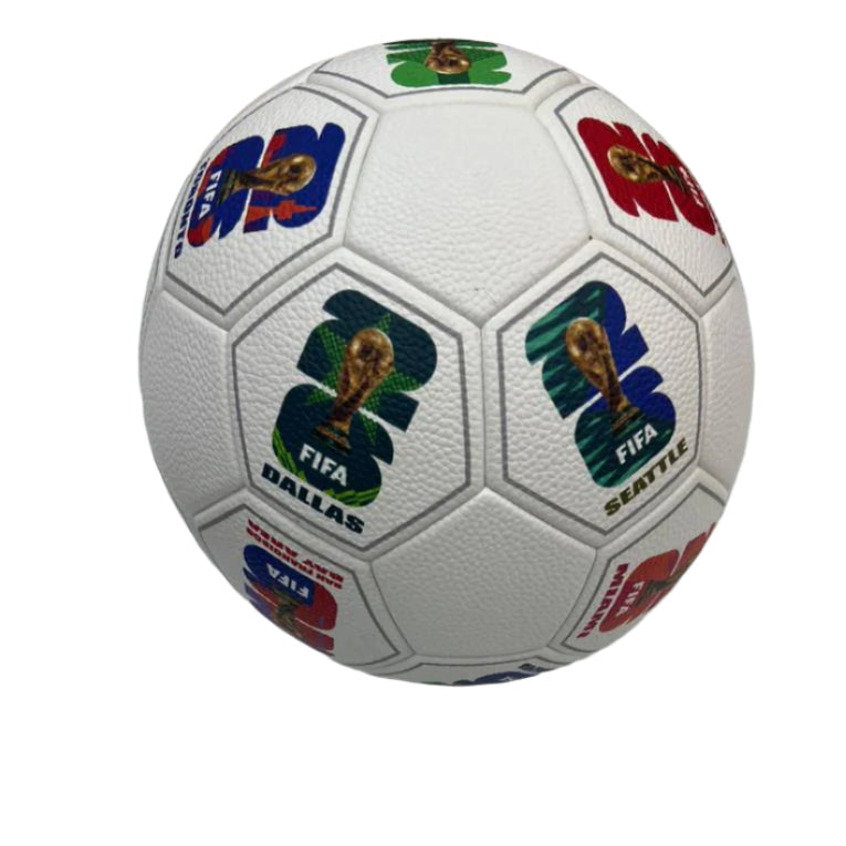 9d4312f1-5511-454b-abac-b63020c121bf White soccer ball covered with FIFA World Cup logos from different host cities (DALLAS, SEATTLE) and teams' emblems