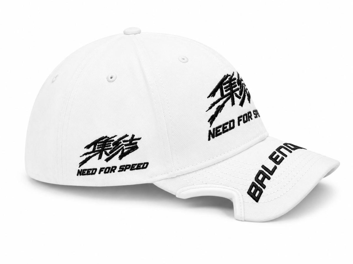 White baseball cap with black embroidered 'NEED FOR SPEED' logos on the side and on the brim