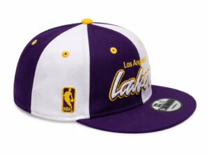 9df3290b-3b57-4282-9a9c-8757ba5491df | UAE SPORT STORE Purple and white Lakers snapback cap with yellow embroidered lettering and NBA logo patch on the side.