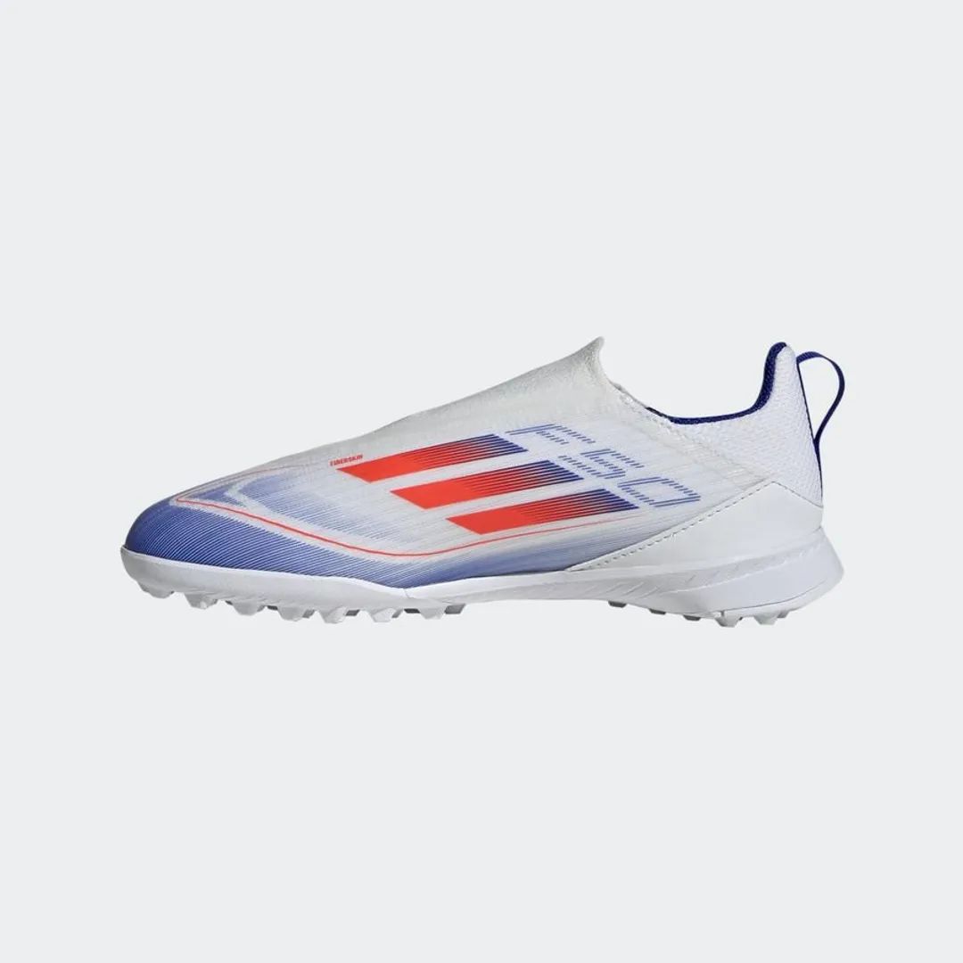 9e69aebc-059e-42f9-ab95-5417f714b713 | UAE SPORT STORE White athletic shoe with a textured upper and blue-red gradient stripes on the side, studded sole for traction (soccer/football cleat).