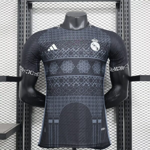 Mannequin wearing a dark Real Madrid football jersey with geometric patterns, Real Madrid crest, and Adidas logo on the chest.