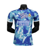 Blue camouflage Real Madrid football jersey on a mannequin, showing the Emirates Fly Better sponsor.