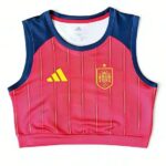 Pink sleeveless training cropped top with blue shoulders, featuring the Spain crest on the chest and a yellow Adidas logo.