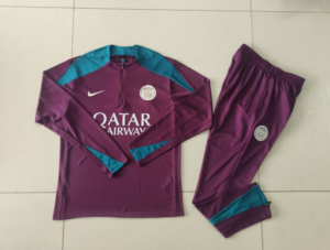Purple Paris Saint-Germain training suit laid flat on tiles with teal panels, featuring Qatar Airways sponsor and PSG crest.