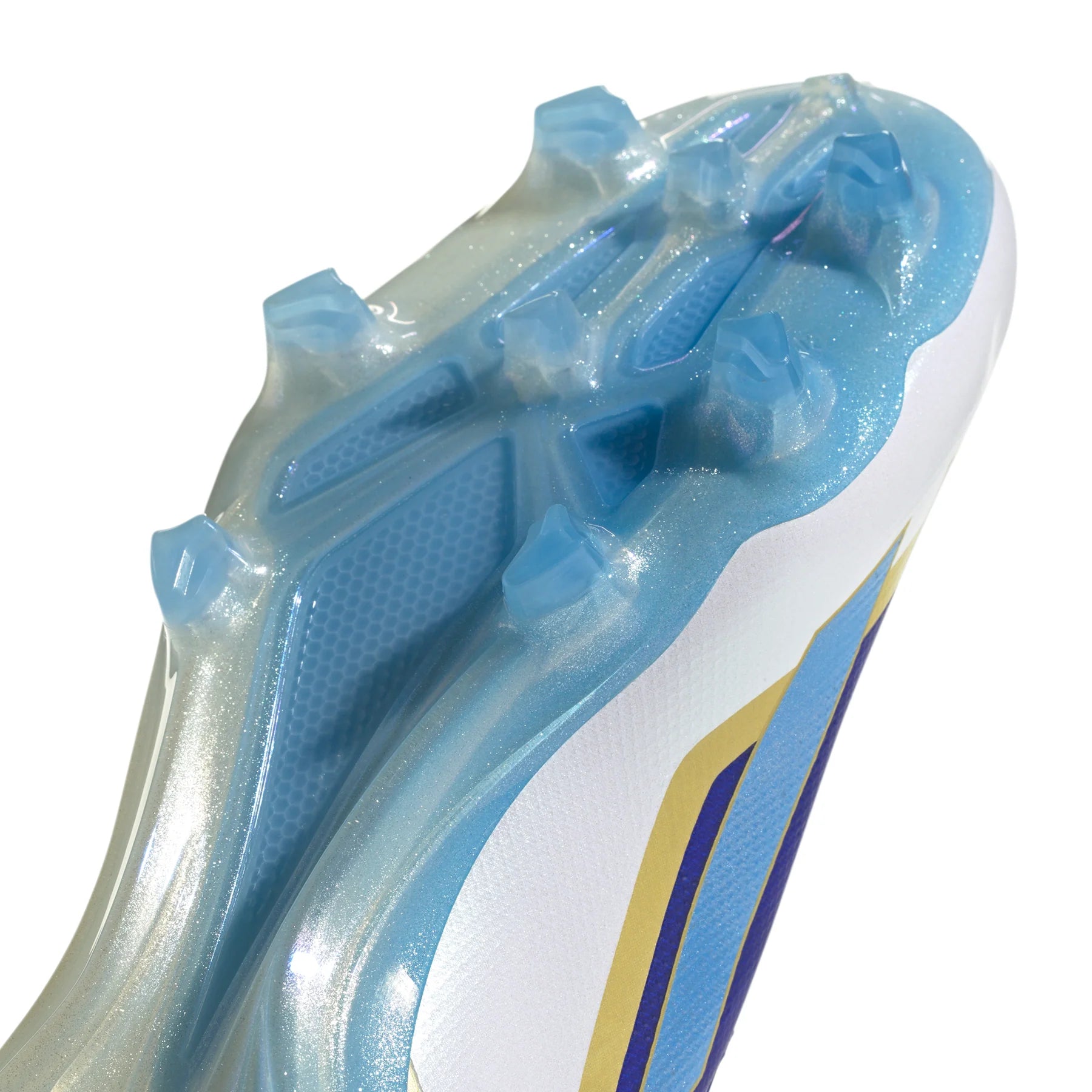 AD-1_0026_ID0710_9_FOOTWEAR_Photography_DetailView3_transparent | UAE SPORT STORE Close-up of a blue cleated athletic shoe sole with studs, angled on a white background.