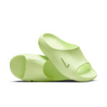 Light-green slide sandals with a textured strap and Nike swoosh on a white background.