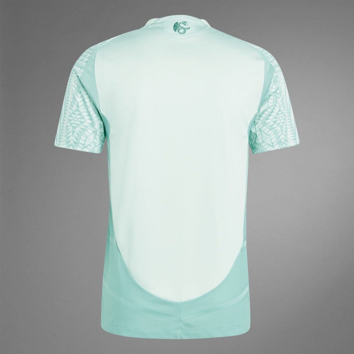 Back view of a mint green athletic jersey with patterned geometric sleeves