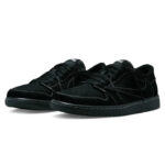 Pair of black suede sneakers with white stitching and a black sole laid side by side on a white background