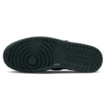 Sole of a black athletic shoe featuring circular grip pattern near the heel and a grid-like tread toward the toe area.