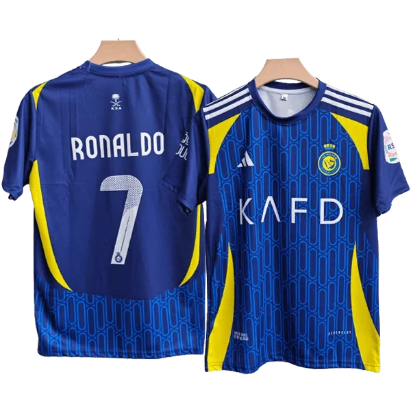 Two blue soccer jerseys with yellow accents shown side by side; one back reads 'RONALDO' and number 7, the other front features a KNFD sponsor and crest.