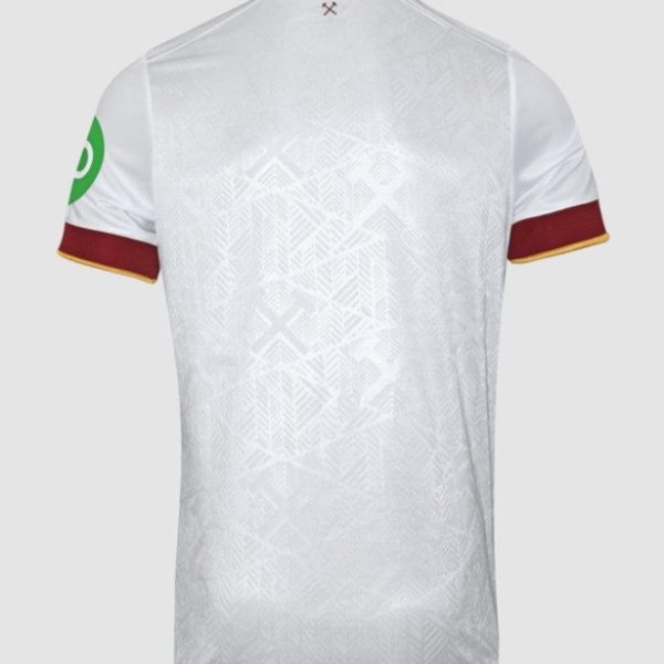 Back view of a white athletic jersey with a subtle geometric pattern, maroon collar and sleeve cuffs with yellow trim, and a green patch on the left sleeve.