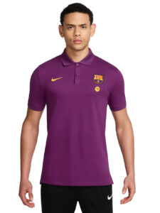 Model wearing a purple FC Barcelona polo shirt with Nike swoosh and Spotify badge against a white background.