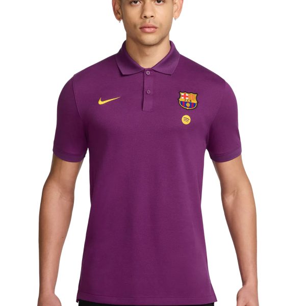 Model wearing a purple FC Barcelona polo shirt with Nike swoosh and Spotify badge against a white background.