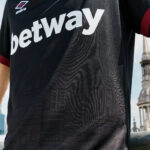 Close-up of a black sports jersey with the word 'betway' across the chest and an Umbro logo in the top left.