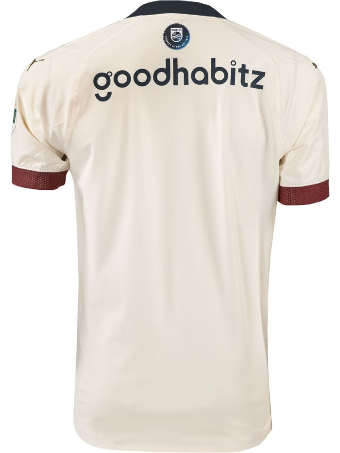 Back-of-PSV-Eindhoven-Away-Shirt-23-24_d93caa5a-1725-4821-8329-1e0fec8ea1bf | UAE SPORT STORE Back view of a cream-colored athletic jersey with the sponsor text 'goodhabitz' across the upper back and a circular crest at the neckline, maroon sleeve cuffs visible.