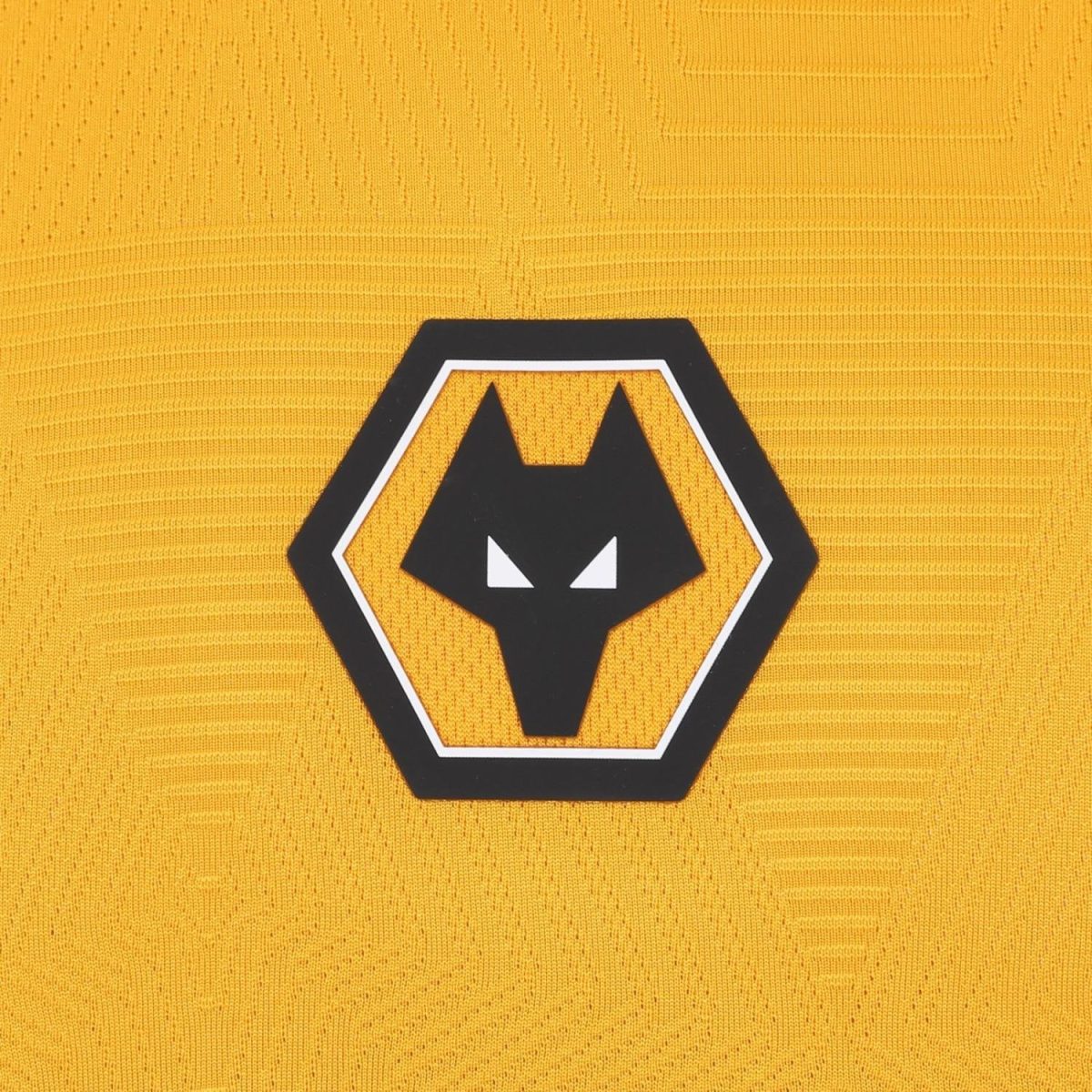 Wolverhampton Wanderers club crest on a gold jersey.