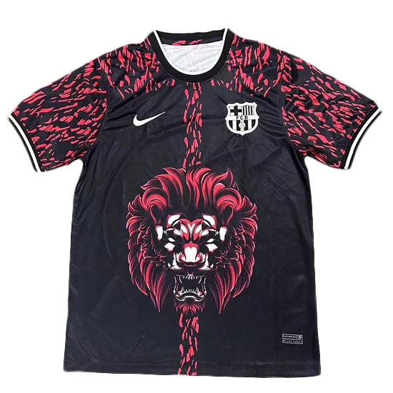 Black Nike football jersey with pink patterned sleeves, Barcelona crest, and a red roaring lion graphic down the center.
