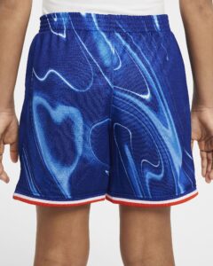 Close-up of blue marble-patterned athletic shorts with an elastic waistband and red-white-blue striped hem.