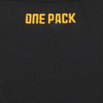 Orange 'ONE PACK' lettering on a black, textured fabric background (close-up).