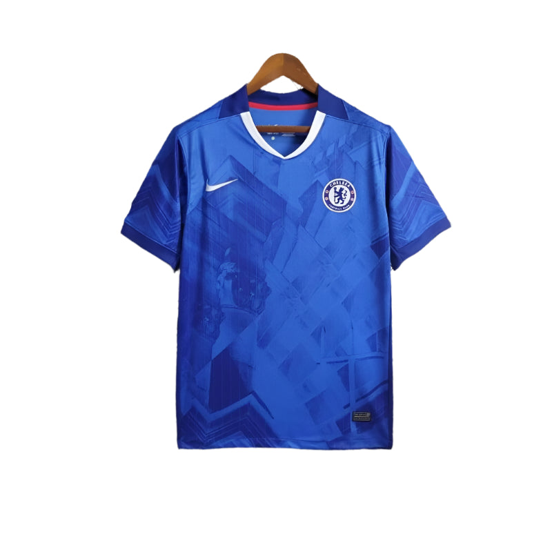 Camiseta-Chelsea-FC-1_-Equipacion-2526camisetafutboles-800x800-1 | UAE SPORT STORE Blue Chelsea FC football jersey on a hanger with white V-neck trim and Nike swoosh on the chest.