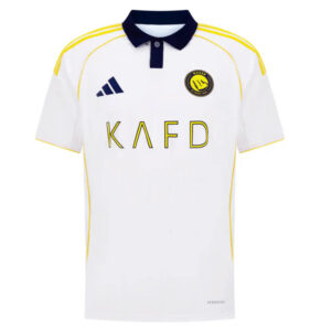 White soccer jersey with a navy collar and yellow piping; features KAFD sponsor text, Adidas logo, and a club crest on the chest.