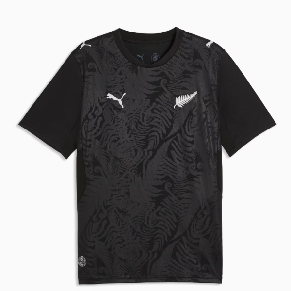 Black short-sleeve athletic shirt with a dark fern pattern and white Puma logos on the chest