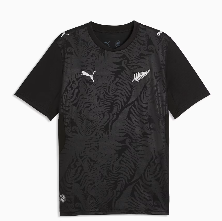 Capture_b52d5118-2404-47d8-a399-689a658c7c9a Black short-sleeve athletic shirt with a dark fern pattern and white Puma logos on the chest
