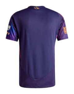 Back view of a purple athletic jersey with orange neckline logo 'LA', pink side panels, and sponsor logos on the sleeves.